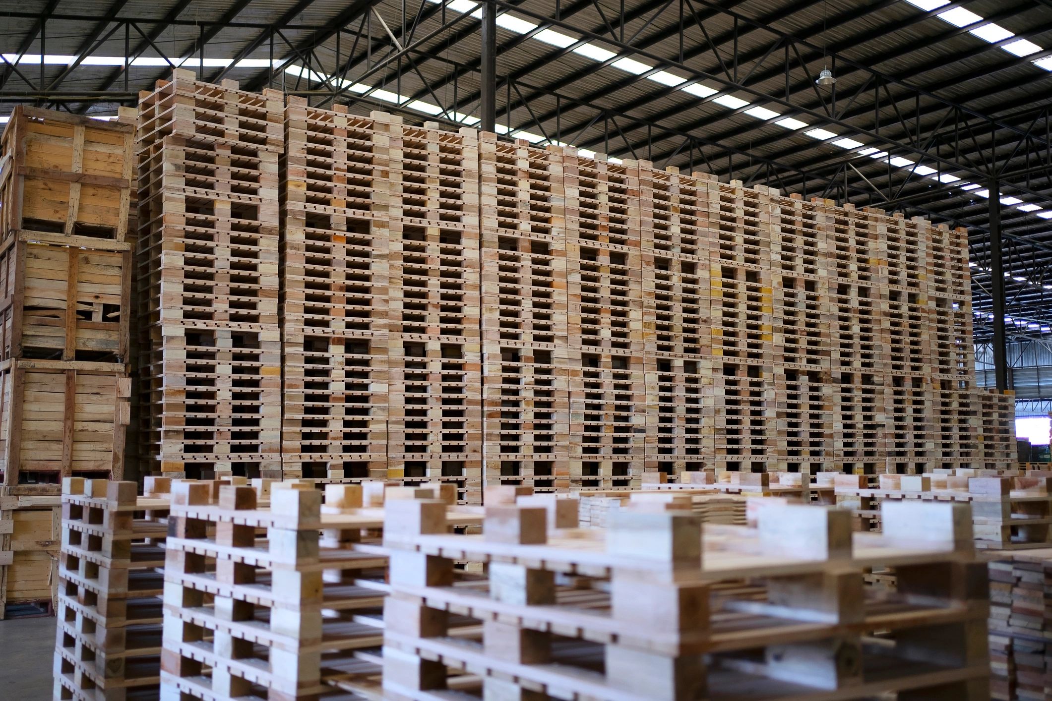 Workers handling building materials in a supply environment
